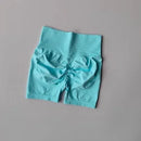 Shorts esportivos de levantamento de quadril pêssego